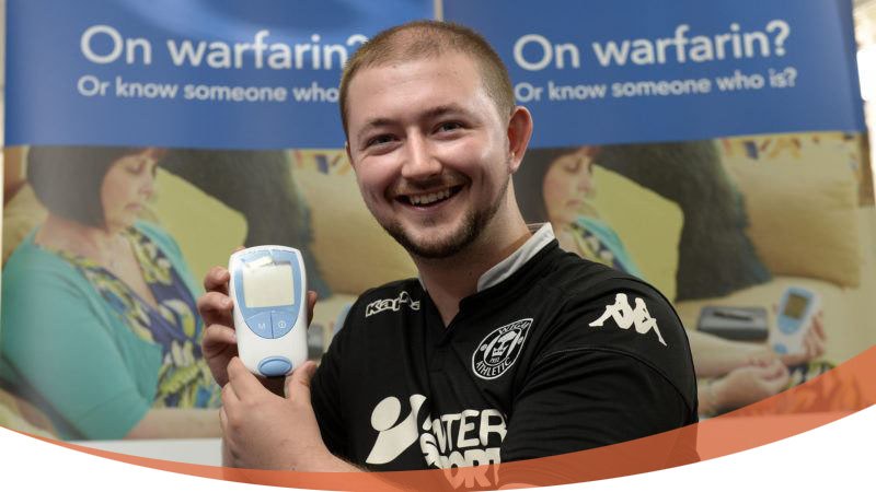 Young rugby player posing with an IRN reader