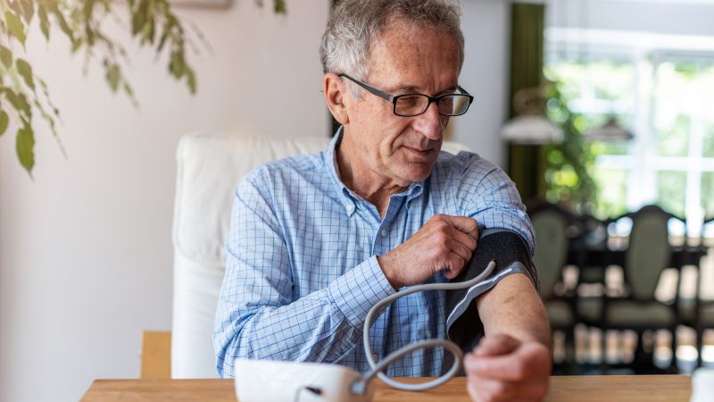 man taking blood pressure